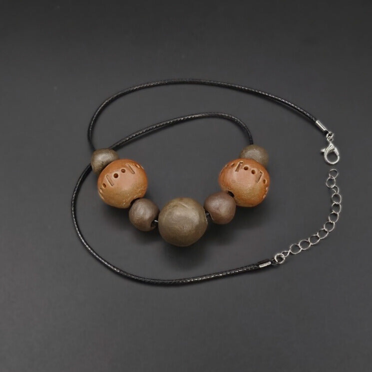 Collier Sept Perles Deux Décorées